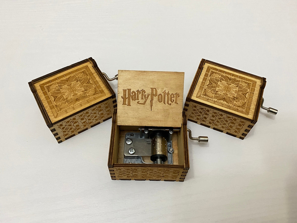 brown wooden box with silver and black camera