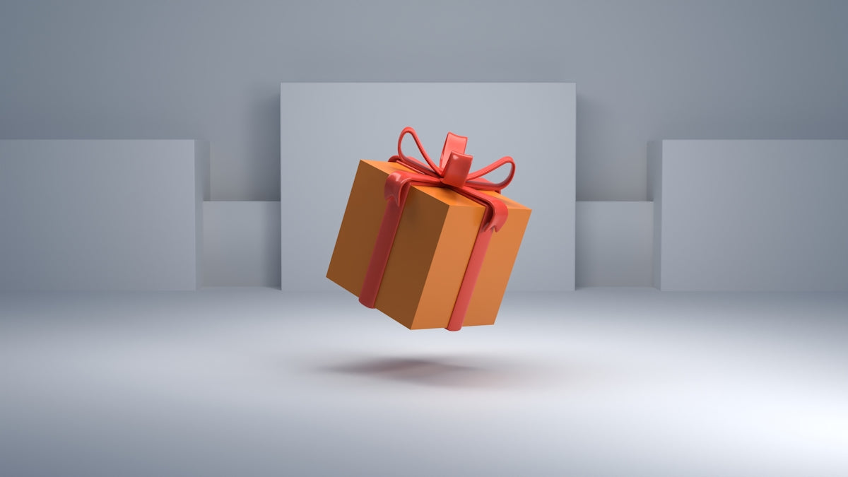 an orange gift box with a red bow