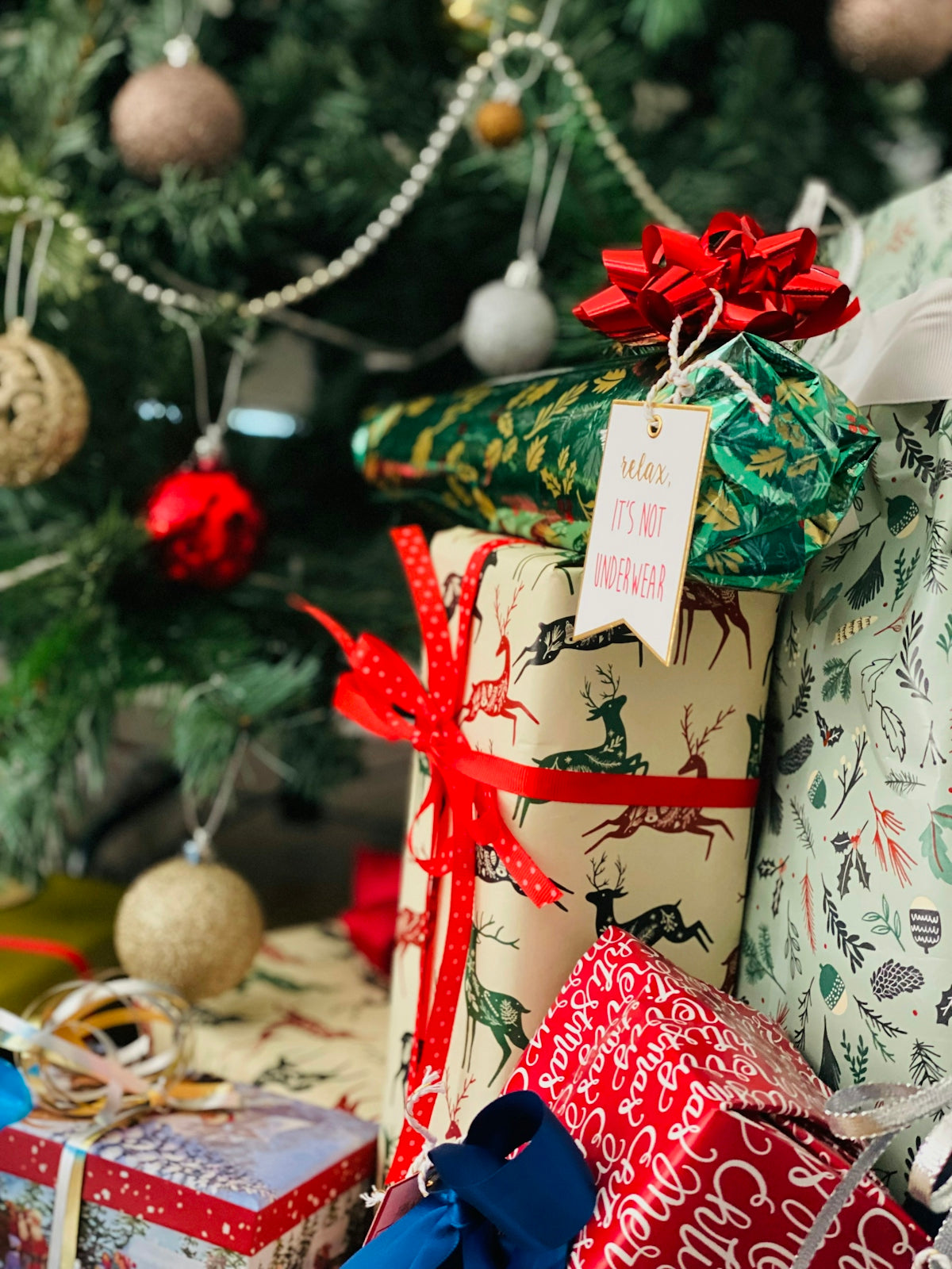 a christmas tree with presents underneath