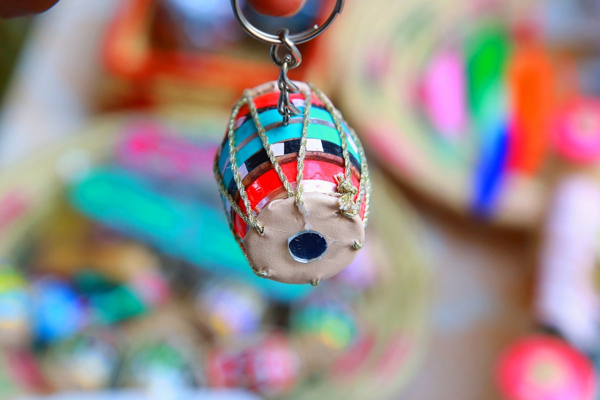 Colorful dholak drum keychain with blurred background