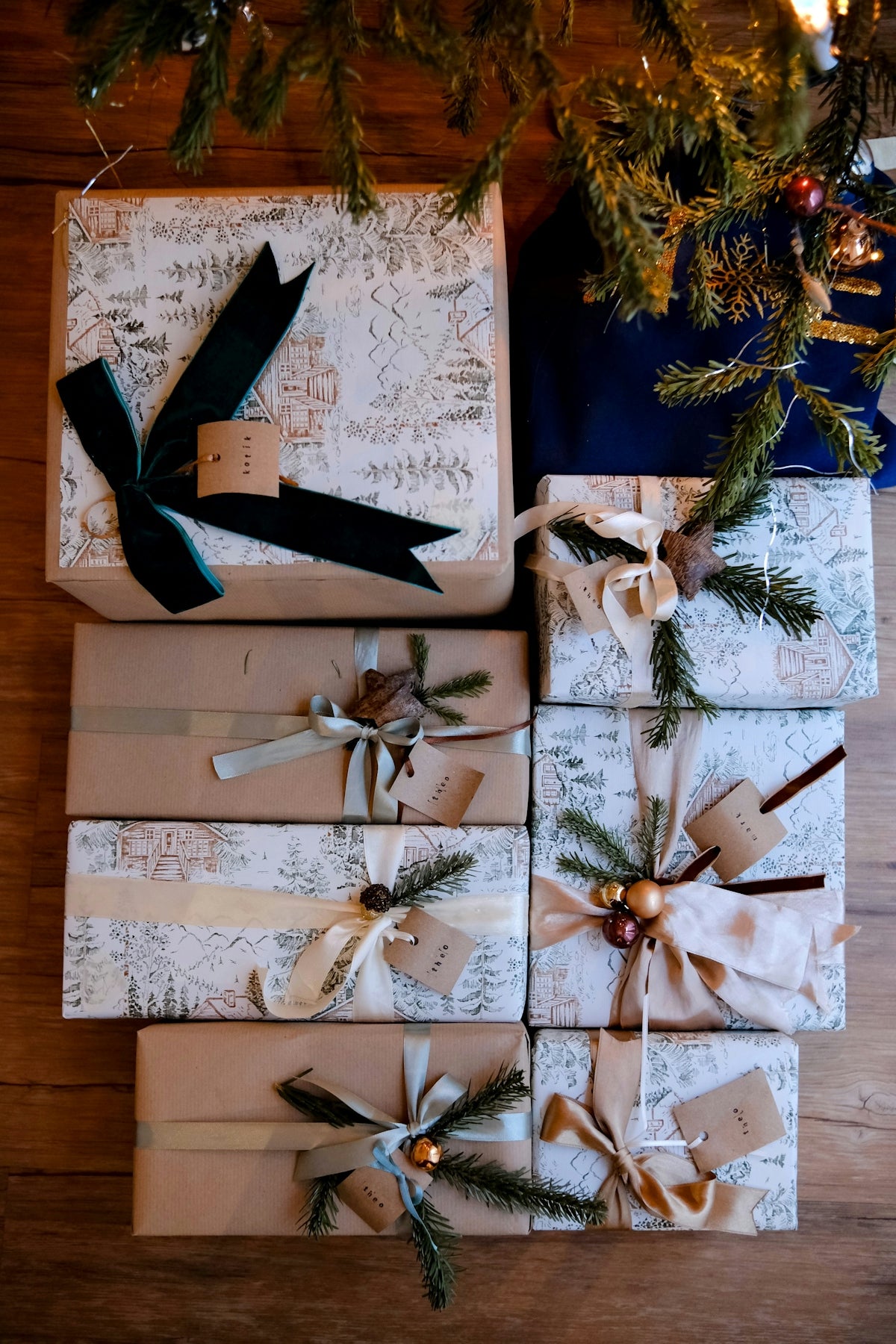 Wrapped christmas gifts under a decorated tree